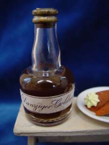 Vintage glass bottle „Danziger Goldwasser“ with liquid,
