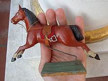 Brown antique miniature toy horse with blaze, made about 1900.
