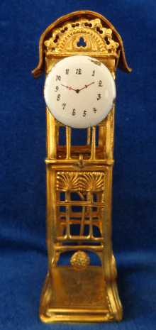 Antique gilt dollhouse hall clock with pendulum, made by Erhard & sons, dated about 1900.