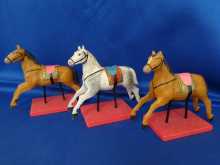 Three antique miniature toy horses, dated about 1900.