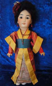 Beautiful antique oriental doll, dated about 1910.