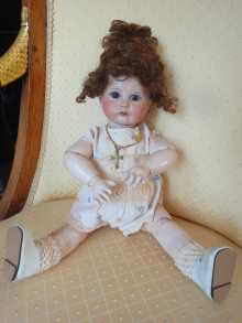 Antique SFBJ 252 pouty doll, with closed pouty mouth and blue glass sleep eyes, dated about 1912.