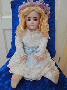 Antique doll with closed mouth, a lovely pouty girl, made by Kestner, dated about 1885.