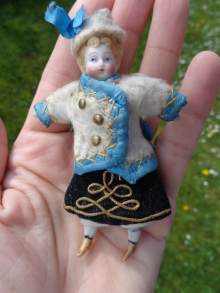 Antique bisque doll, a cute Russian lady, made about 1900.