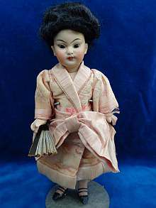 Antique oriental doll