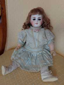 Beautiful antique doll, with open-closed mouth, dated about 1880.