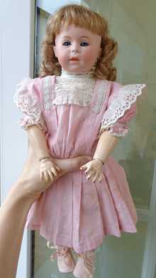 Antique doll, beautiful character doll with closed mouth made by Swaine & Co., dated about 1910.