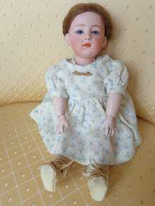 Antike Porzellankopfpuppe, liebliche Charakterpuppe von Heubach, um 1912.